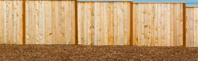 mulched area near fence