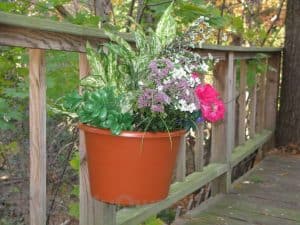 A unique hanging basket designed to fit on the posts of your wooden deck.