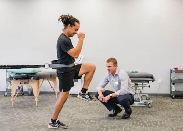 Physical Therapy Often Involves Exercises Like This Person Working With a Resistance Band.